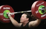 FILE - In this April 9, 2018, file photo, New Zealand's Laurel Hubbard lifts in the snatch of the women's 90kg weightlifting final at the 2018 Commonwealth Games on the Gold Coast, Australia. Hubbard, a transgender woman, is competing in weightlifting for New Zealand (AP Photo/Mark Schiefelbein, File)